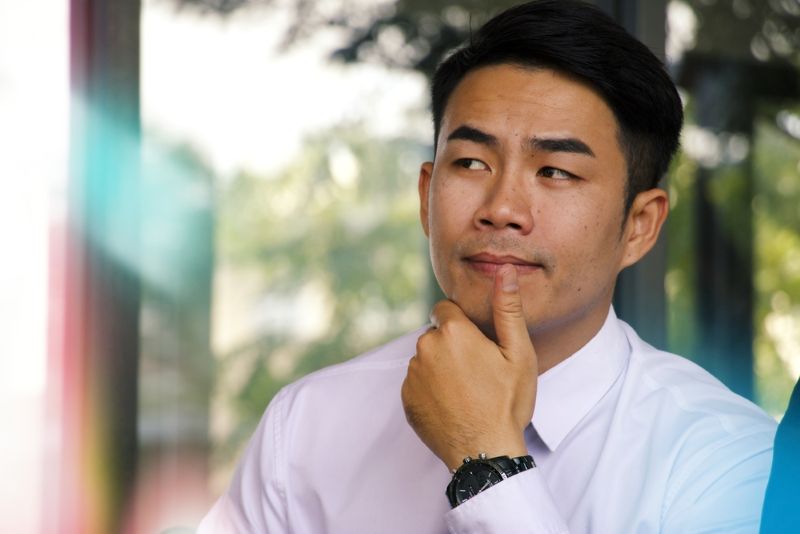 Serious businessman thinking deeply to himself while at work